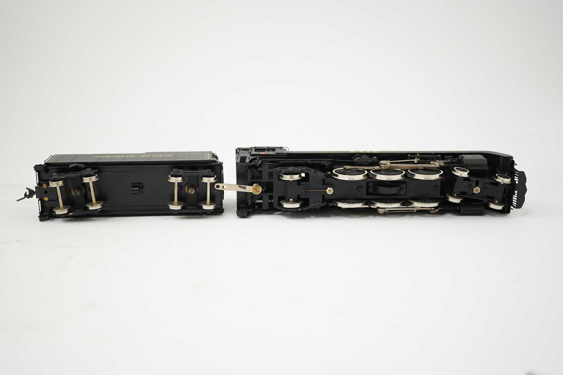 Two boxed HO gauge Canadian Pacific locomotives; a Toby of Japan model of 2412, 4-6-2 locomotive with bogie tender, together with a United Scale Models 3710, 2-8-0 locomotive with bogie tender, both powered for two rail